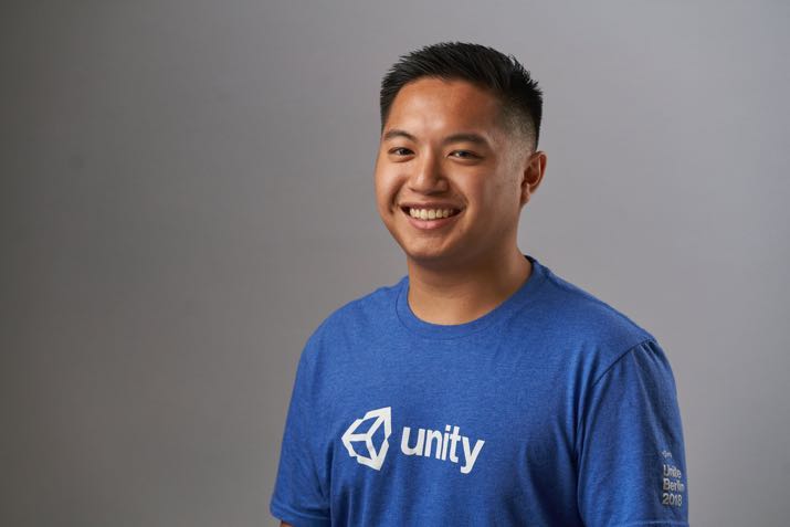 Carl Domingo, wearing a blue Unity shirt. 