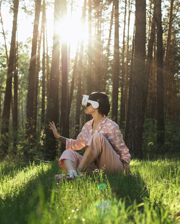 a photo of a child with a vr headset on sitting in a field of grass