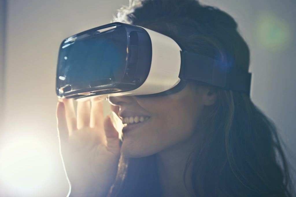 a photo of a woman with a vr headset on